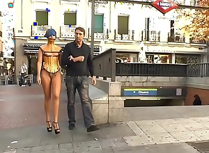 Naked cosset in plastic corset public d